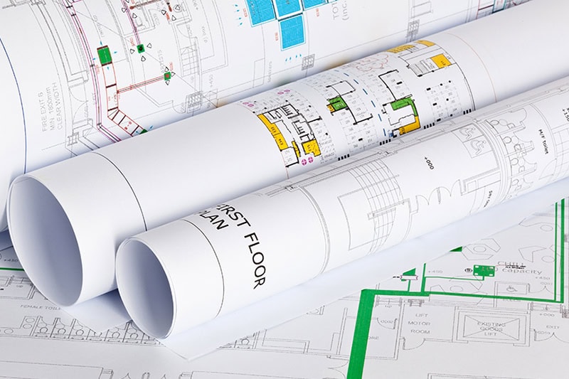 Commercial HVAC planned rolled up on a table.